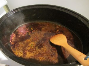 Deglazing the pan with red wine.