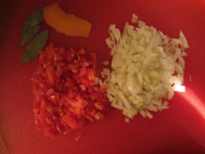Onion, bell pepper, orange zest, and bay leaves.