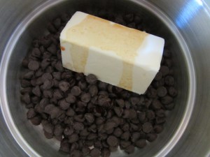 Melting chocolate chips with butter and vanilla.