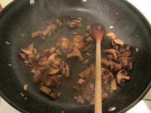 Sauteeing the mushrooms.