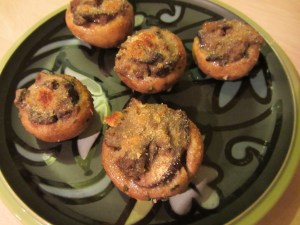 A perfect appetizer plate of stuffed mushroom caps.