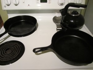 Heating two cast iron skillets.