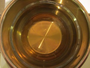 Pot rubbed with garlic and filled with hard cider, Kosher salt, lemon juice, and brandy.