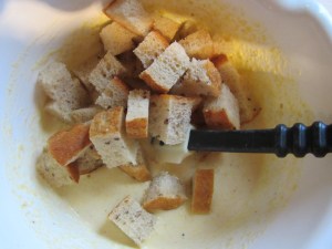 Folding in bread cubes.