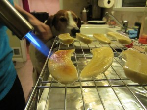 Torching the bananas, with a helper.