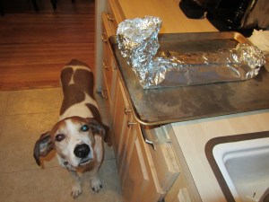 Using the foil like a funnel for the braising liquid.
