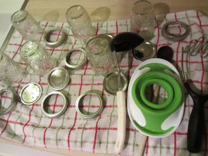 Jars, bands, funnel, masher, and ladle after hand washing.
