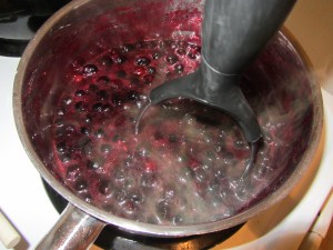 Mashing the blueberries.
