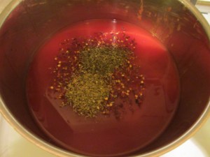 Tomato liquid plus sherry vinegar, sugar, red pepper flakes, oregano, and basil.