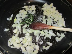 Sweating onion with salt and Rosemary.
