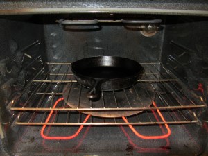 Cast iron skillet heating in the oven.