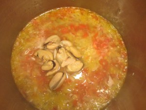 Ten mussels added to cooking liquid for sauce.