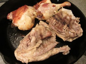 Duck breasts added to skillet with legs.