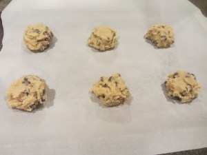 Six cookies per parchment-lined sheet.