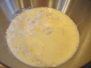 Adding wet ingredients to dry ingredients once the pan is hot.
