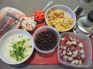 Ingredients for turkey hash:  breakfast sausage, onion, jalapeno, bell pepper, cooked red potatoes, black beans, leftover corn bread pudding, leftover turkey, cayenne, salt, and pepper.