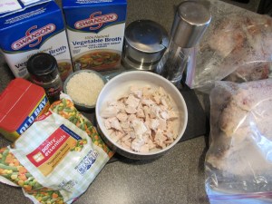 Ingredients for turkey soup:  vegetable broth, turkey carcass, frozen vegetables, rice, cubed turkey, Old Bay, thyme, salt, and pepper.