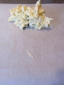 Compound butter on one end of parchment.