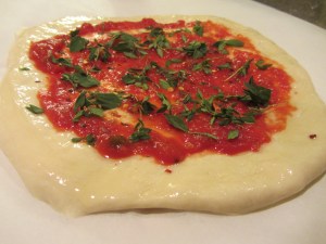 Sauce topped with fresh oregano, fresh thyme, and crushed red pepper.