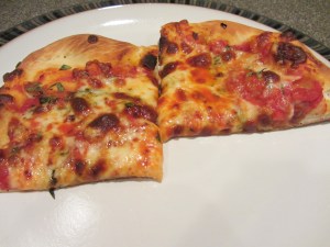 Original pizza, cut into slices on day 2.