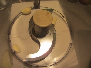 Garlic into the food processor.