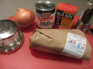 Ingredients for catfish au lait:  evaporated milk, Old Bay Seasoning, black pepper, Kosher salt, onion, and catfish fillets.