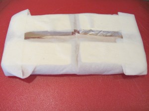 Tofu fillets after sitting in paper towels for an hour.