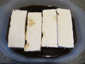Tofu fillets into marinade for 15 minutes.