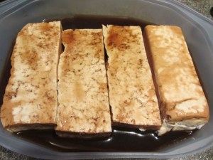Tofu fillets flipped to marinate for 15 minutes on side two.