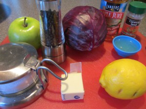 Ingredients for braised cabbage:  canola oil, Granny Smith apple, apple juice, caraway seed, Kosher salt, black pepper, red cabbage, lemon juice, and butter.