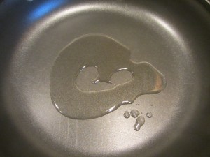 2 T canola oil heating in a pan.