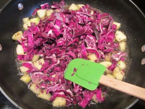 Shredded cabbage added to the pan.