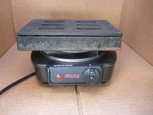 Smoke box placed on electric hot plate.