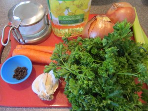 Ingredients for Alton's beef broth:  Kosher salt, canola oil, onions, black peppercorns, garlic, carrots, parsley, and celery. Not pictured:  beef pieces and water.