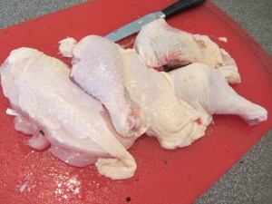 My chicken after portioning Alton's way. Not a perfect job.