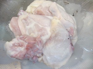 Drained chicken pieces.