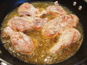Chicken pieces added to skillet for 12 minutes.