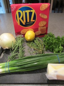 Ingredients for stuffed lobster:  Ritz crackers, onion, lemon, thyme, rosemary, parsley, scallions, and butter.