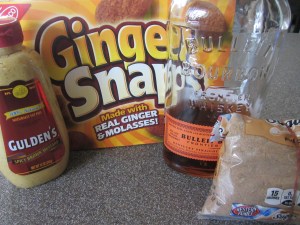 Ingredients for Alton's ham crust:  mustard, gingersnaps, bourbon, and dark brown sugar.