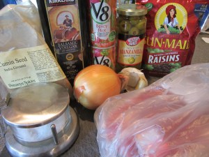 Ingredients for Alton's pot roast:  2 pound blade chuck roast, Kosher salt, cumin, balsamic vinegar, tomato juice, onion, garlic, green olives, and dark raisins.