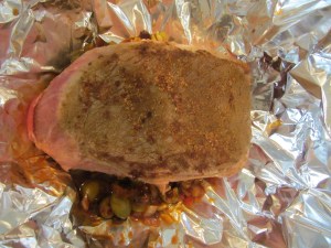 Meat placed on olive mixture.