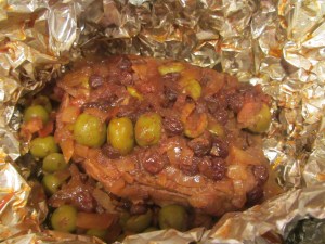 Roast after cooking. Olives and raisins added to liquid in a blender.